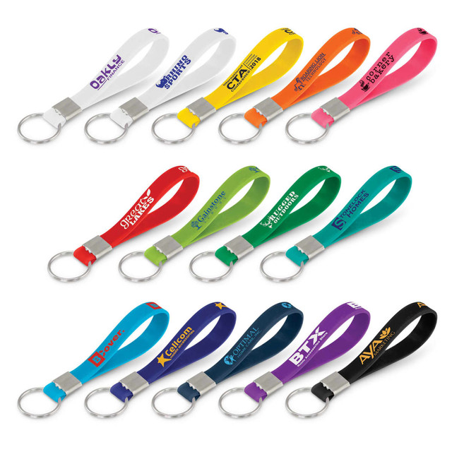 A collection of silicone key rings in various colours, each with a metal ring and different logos.