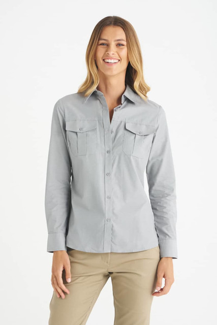 A light grey button-up shirt with two front pockets, designed for women, featured on a model.