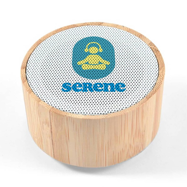 A bamboo Bluetooth speaker with a round shape and a mesh top featuring a logo.