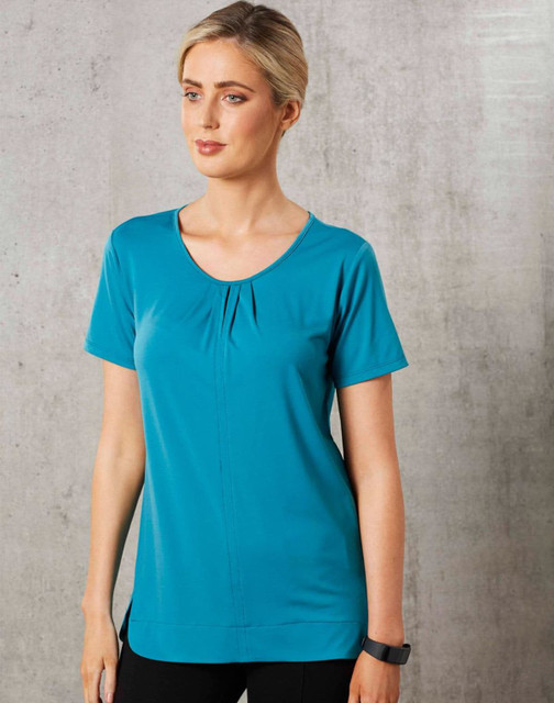 Teal ladies' round neck knit top with pleats and short sleeves, featuring a logo. Smooth fabric and a relaxed fit.