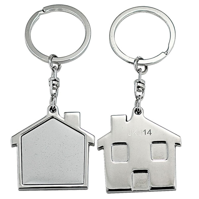 A silver keyring set featuring house-shaped designs, one with a flat surface and the other with a door detail.