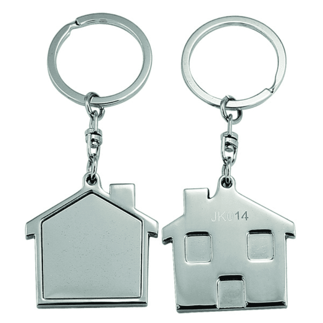 A silver keyring featuring a house-shaped charm with a smooth surface and a split ring for attaching keys. A silver keyring featuring a house-shaped charm with a smooth surface and a split ring for attaching keys.