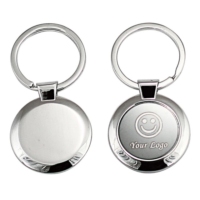 A keyring featuring a circular metal design with a shiny silver finish and a space for custom branding. A keyring featuring a circular metal design with a shiny silver finish and a space for custom branding.