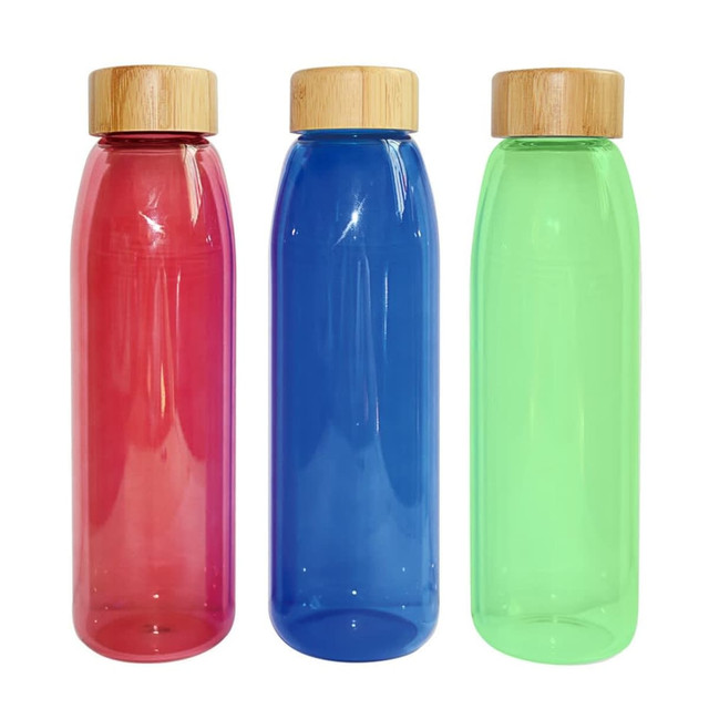 A drink bottle trio featuring pink, blue, and green bottles with bamboo lids and a logo.