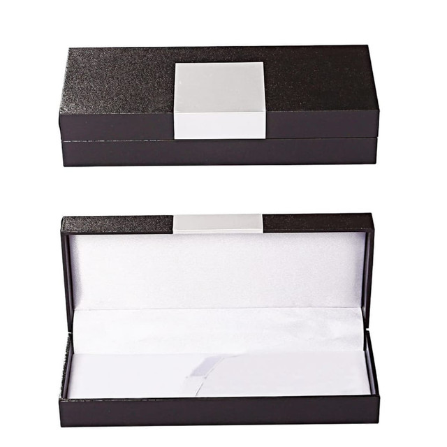 A black pen packaging box with a smooth exterior and a white interior lining. It has a plain white label on top. A black pen packaging box with a smooth exterior and a white interior lining. It has a plain white label on top.