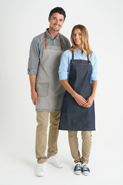 A grey bib apron and a navy bib apron are worn by two models, both with logos and casual outfits.