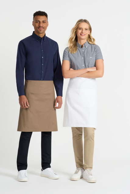 A navy blue button-up shirt and a checkered short sleeve shirt worn by two models, each in an apron.