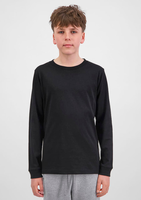 A youth long sleeve tee in black, featuring a simple design and long sleeves. The model stands against a plain background.