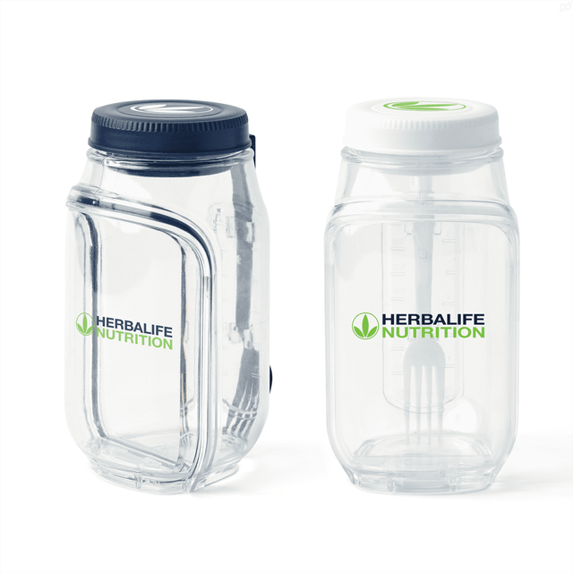 A clear salad jar with a dark blue lid and a white lid, featuring a logo on each container.