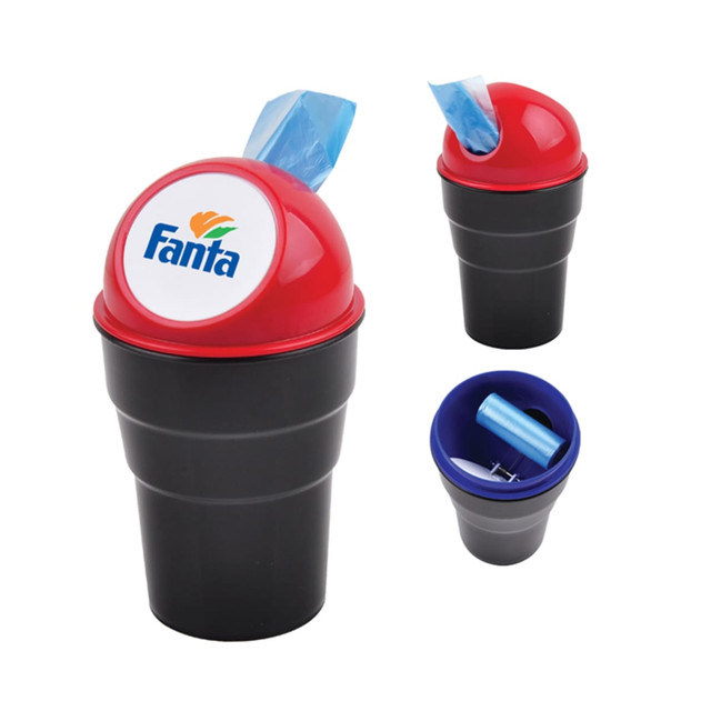 A black trash bin with a red lid featuring a logo, holding blue waste bags.