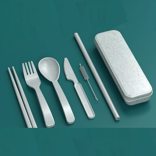 A cutlery set featuring a fork, spoon, knife, chopsticks, straw, cleaning brush, and a textured storage case.