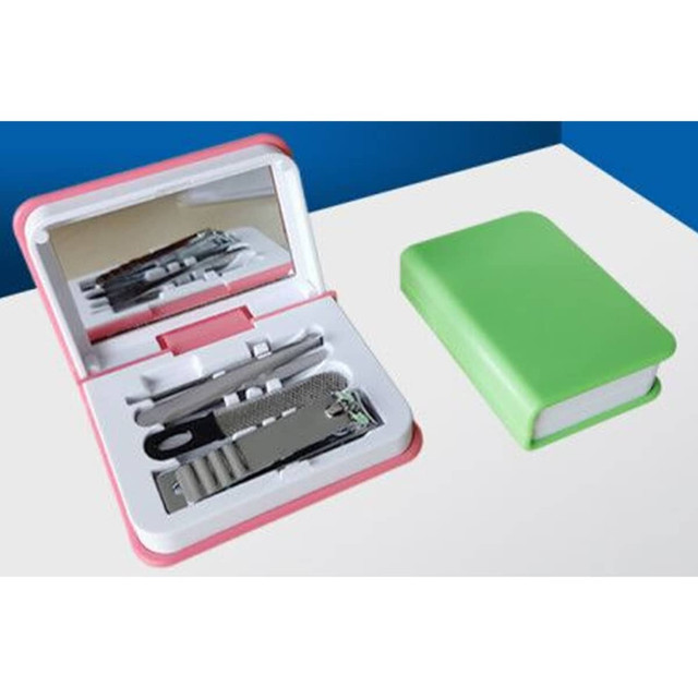 A green and pink manicure set containing grooming tools, including scissors, a file, and nail clippers.