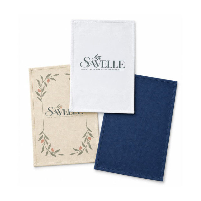 Three medium cotton tea towels in cream, white, and navy blue, featuring a logo on one towel.
