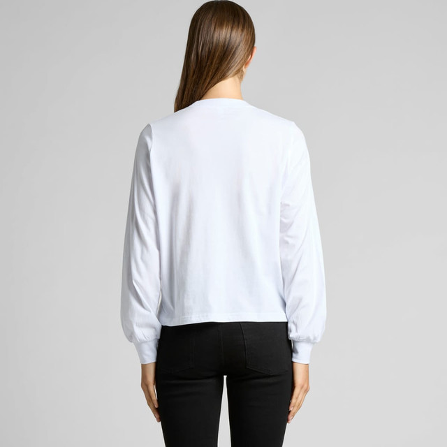 A white long-sleeve t-shirt with puffed sleeves, viewed from the back, paired with black pants.
