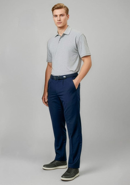 A model wearing navy slacks paired with a grey polo shirt and styled with casual shoes. The outfit features a logo.