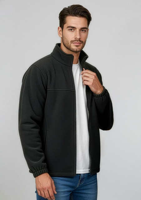A black micro fleece jacket with a zip front and stand-up collar, worn by a model with a white t-shirt underneath.