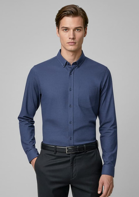A men's long sleeve button-up shirt in navy blue with a front pocket and a collar. It features a logo.