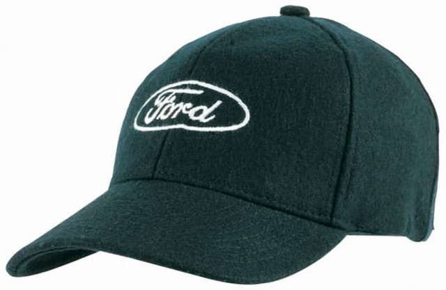 A green Melton wool cap featuring an embroidered logo on the front. The cap has a classic baseball style.