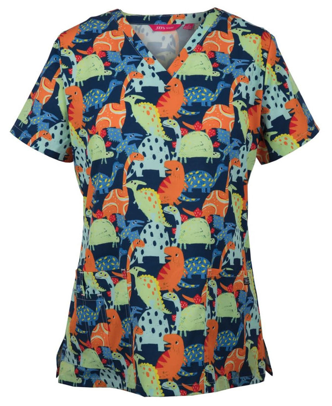 A ladies' scrub top featuring a colourful dinosaur print in blue, orange, green, and pink with a v-neck design.
