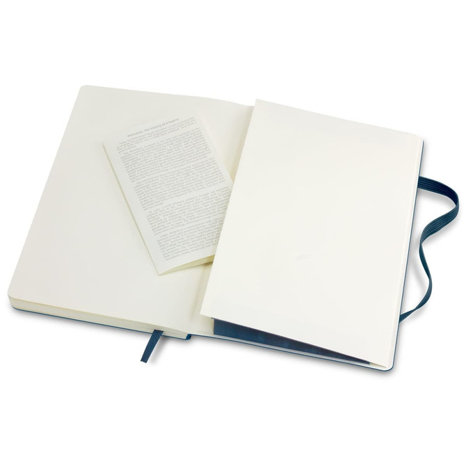 A large soft cover notebook in navy blue, featuring blank pages and a ribbon bookmark. Includes an insert.