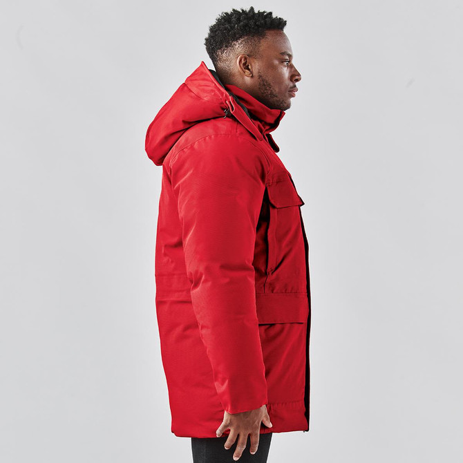 A red Men's Denali Parka jacket with a hood, featuring side pockets and a tailored fit.