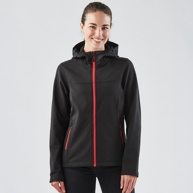 A black women's softshell hoody featuring red zip accents and a hood, with a logo on the chest.