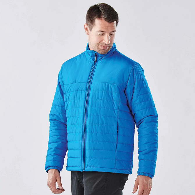 A blue quilted jacket for men with a zip closure and a logo on the chest.
