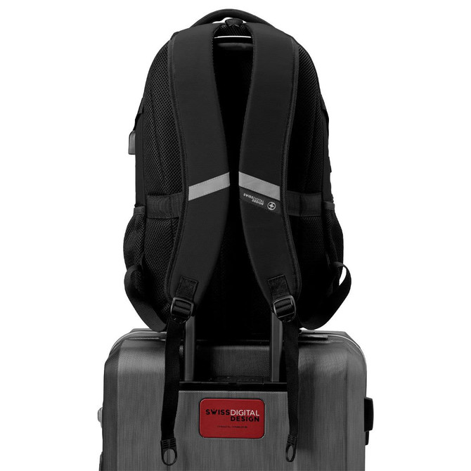 A black Swissdigital Vector Backpack with padded straps, positioned on top of a suitcase, featuring a logo.
