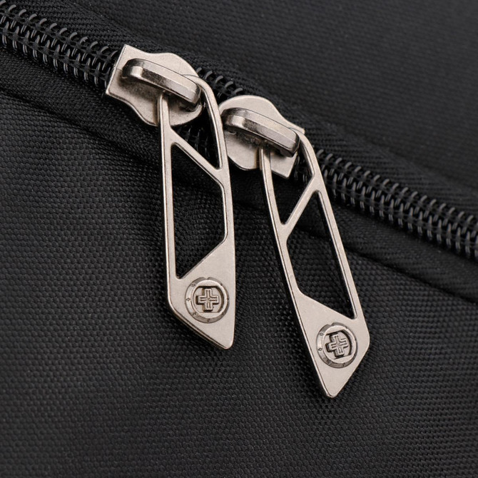 Close-up of a black backpack zipper featuring metallic, geometric pull tabs. The fabric has a textured finish.