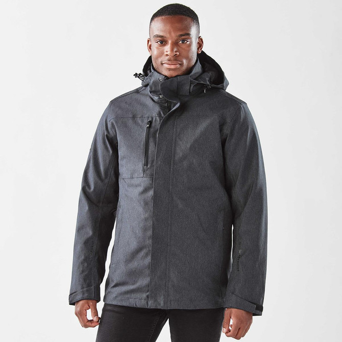 A dark grey men's jacket with a hood, featuring a zip front and an exterior pocket, displayed on a model.