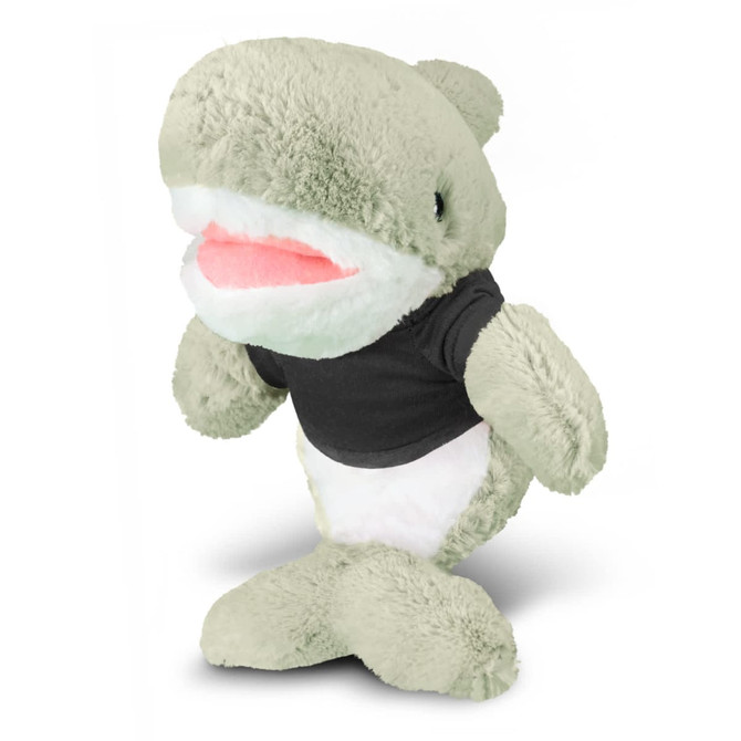A plush shark toy in light green with a white belly, wearing a black shirt, featuring a friendly expression.