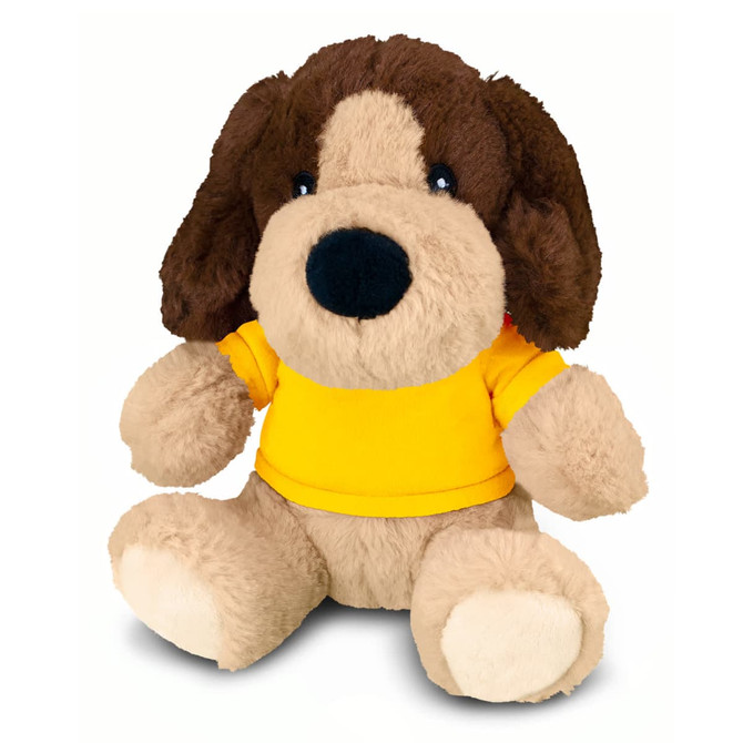 A brown and beige plush dog toy, wearing a yellow shirt, with large eyes and floppy ears. It has a branded tag.