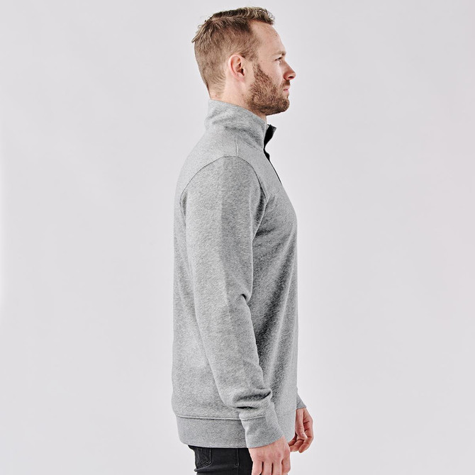 A grey men's 1/4 zip pullover with a high collar, featuring a logo on one side.