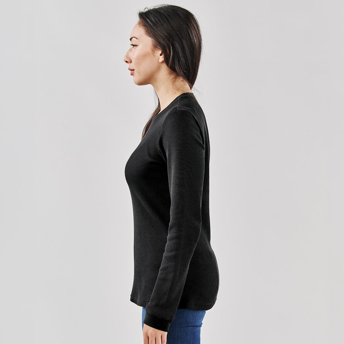 A black crew neck shirt displayed on a model from the side, showcasing a fitted silhouette.
