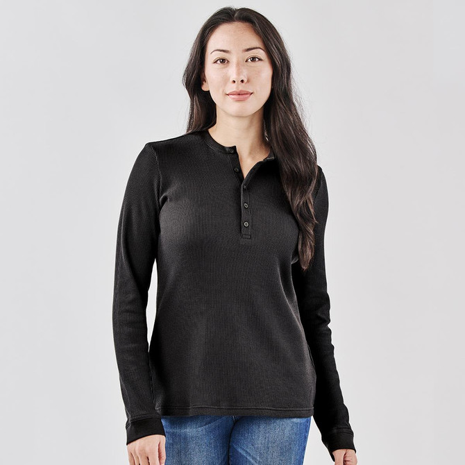 A black Women's Ashburn Henley shirt featuring long sleeves and a buttoned neck. It includes a logo on the fabric.