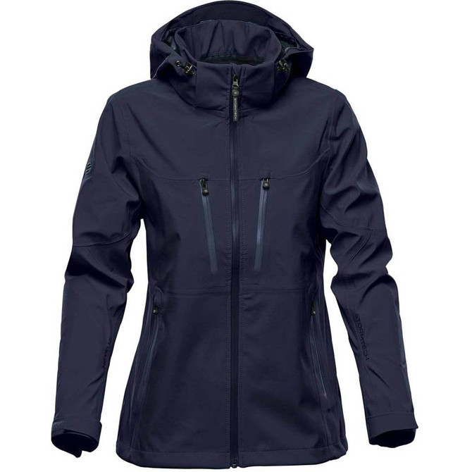 A women's softshell jacket in navy blue with a hood and multiple zippered pockets. It features a logo on the sleeve.