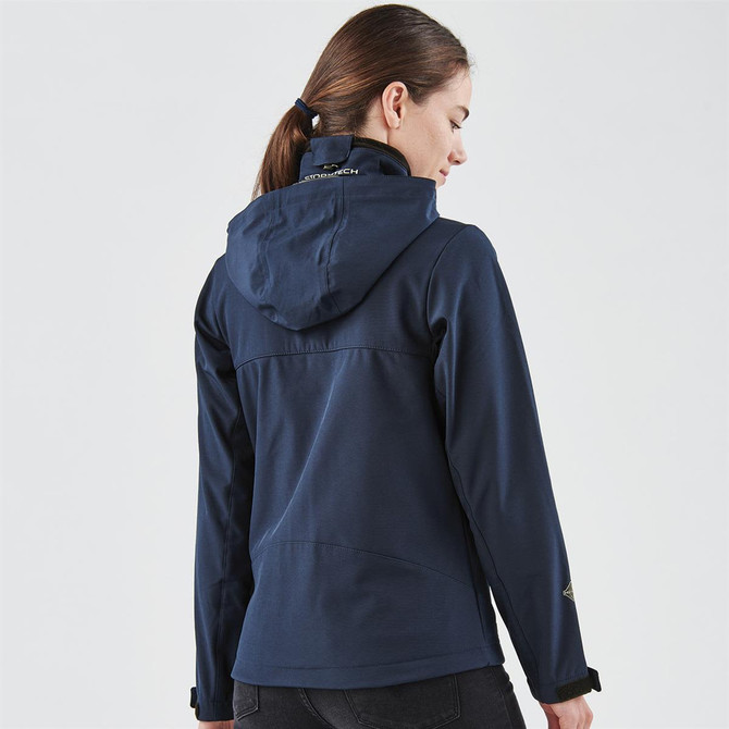 A navy softshell jacket featuring a hood and logo on the collar, shown from the back.