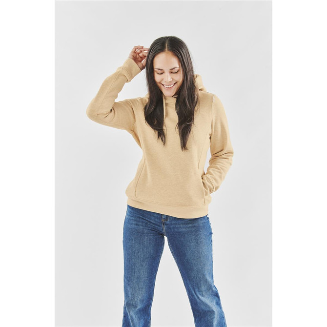 A women's fleece pullover hoody in a tan colour, paired with blue jeans, featuring a hood and front pocket.