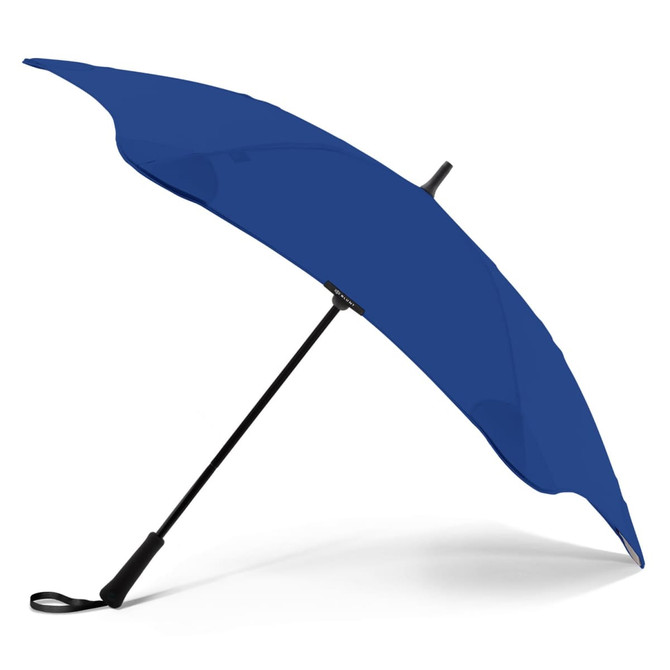 A blue BLUNT Classic Umbrella with a curved canopy and a sturdy black handle. It features a logo on the shaft.