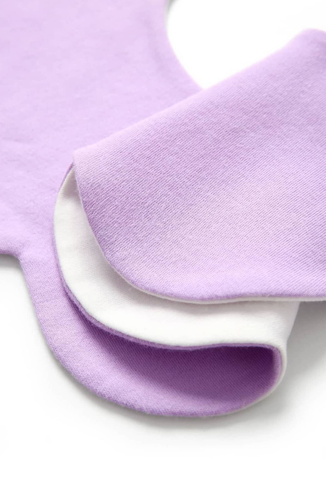 A 100% organic cotton baby bib in lavender and white, featuring a soft interlock texture and rounded edges.