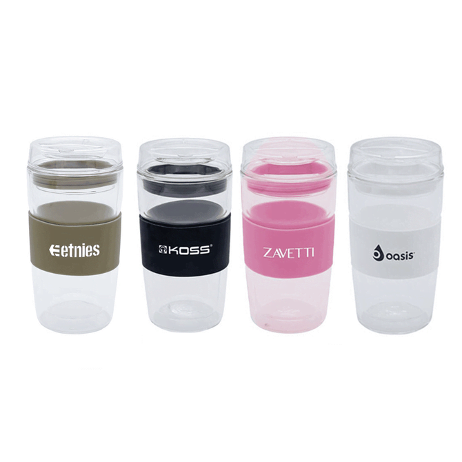 Four reusable coffee cups in various colours, featuring black, pink, green, and clear designs, each with a logo.