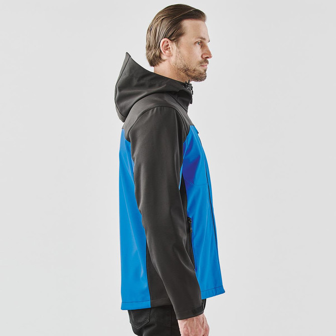 A men's softshell jacket featuring a blue and black design, with a hood and side pockets.