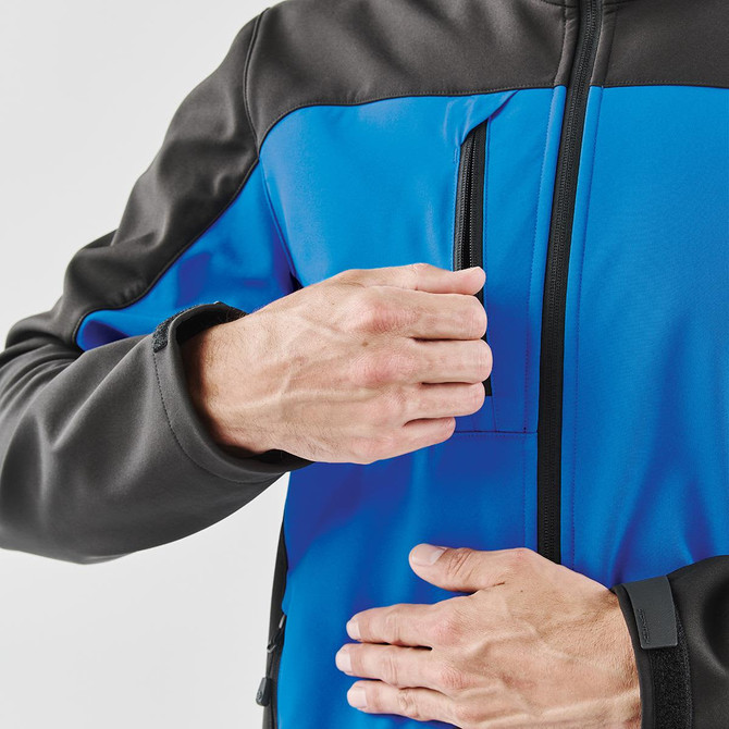 A men's softshell jacket featuring a vibrant blue body and black accents, with a zippered chest pocket.