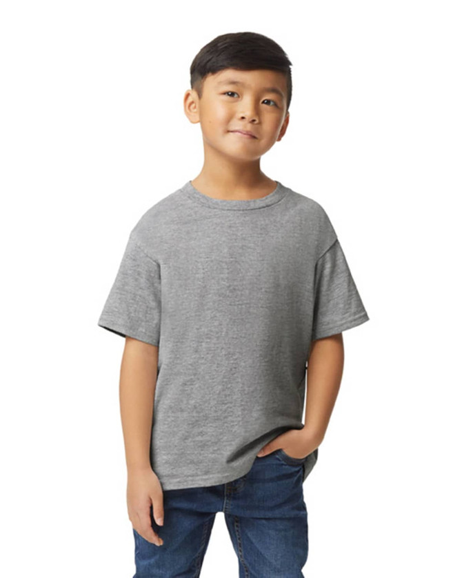 A grey youth midweight T-shirt with short sleeves, worn by a child standing with one hand in pocket. It features a logo.