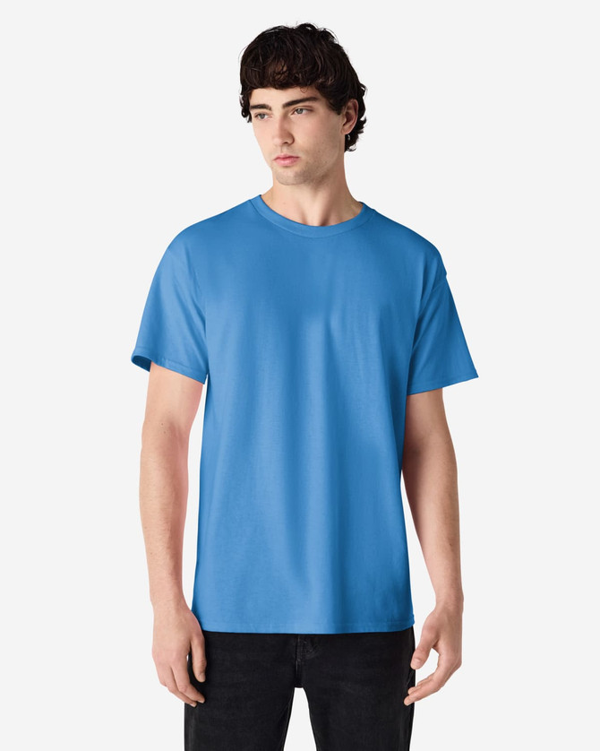 A blue Gildan Ultra Cotton adult t-shirt displayed on a model, featuring a simple design and short sleeves.