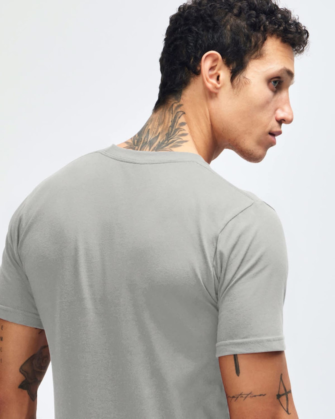 A grey fine jersey short sleeve t-shirt featured on a person from the back, showcasing the garment's fit and style.