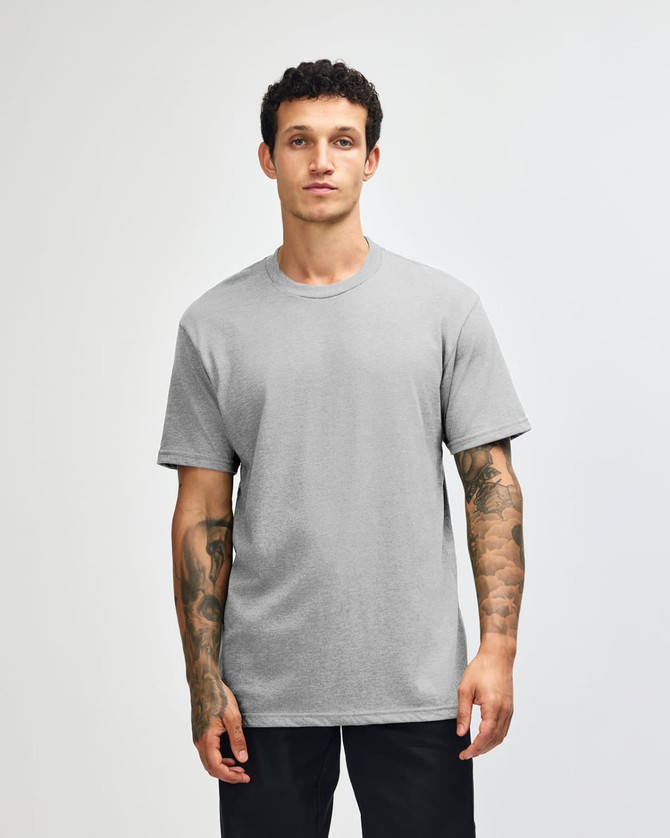 A grey unisex CVC short sleeve T-shirt on a model with a plain background, featuring a logo.