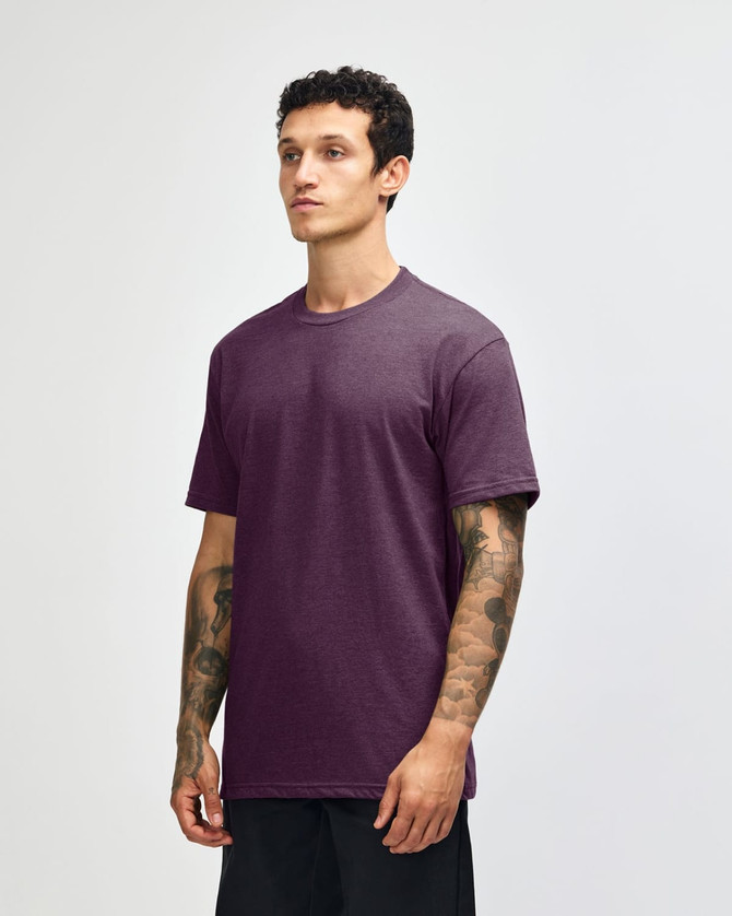 A unisex short sleeve t-shirt in a deep purple colour, featuring a simple design and a logo.