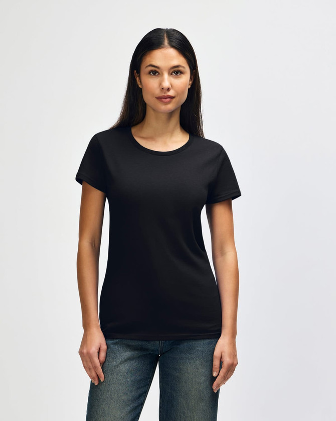 A black Gildan Heavy Cotton Ladies' T-Shirt displayed on a model, featuring short sleeves and a relaxed fit.