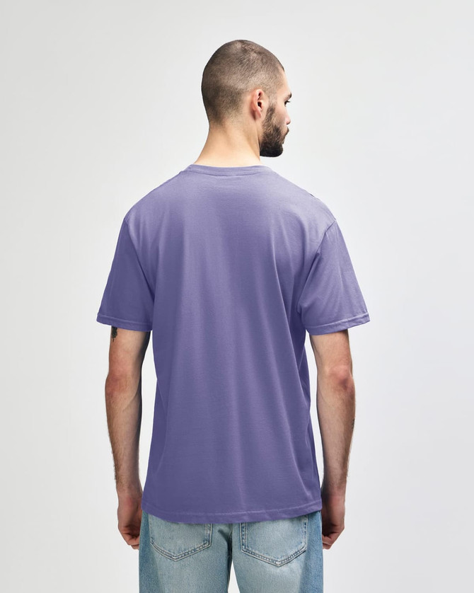 A midweight adult t-shirt in purple, featuring a simple design and a branding logo on the back.